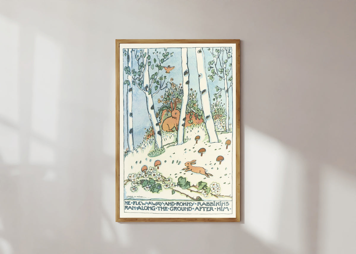 Framed art print of Mummy's Bedtime Story Book: He Flew Away and Ronny Rabbinkins Ran Along… by Jessie M. King, in a light wood frame on a sunlit white wall