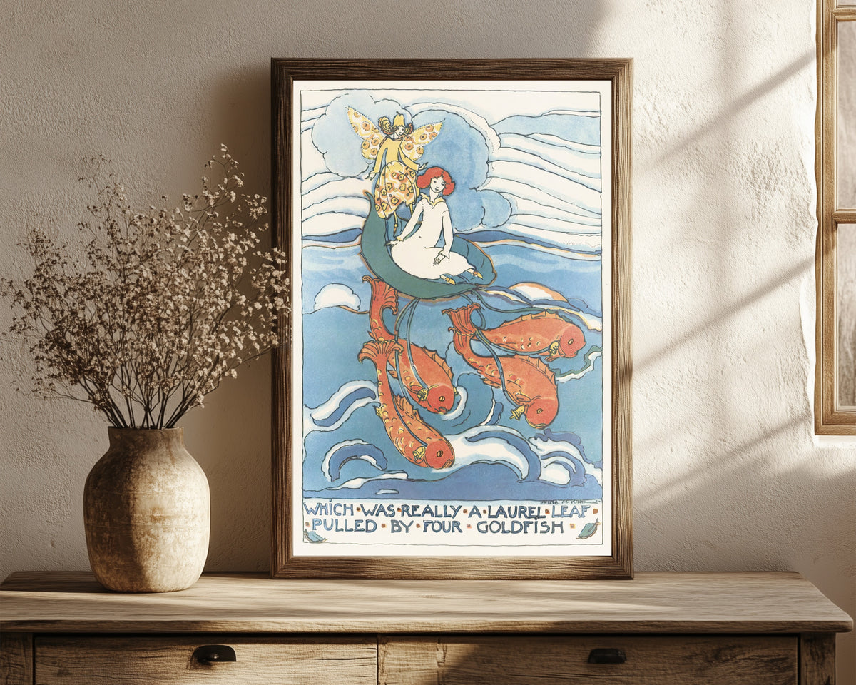 Framed art print of Mummy's Bedtime Story Book: Which Was Really a… by Jessie M. King, in a dark wood frame leaning on a rustic console beside dried flowers