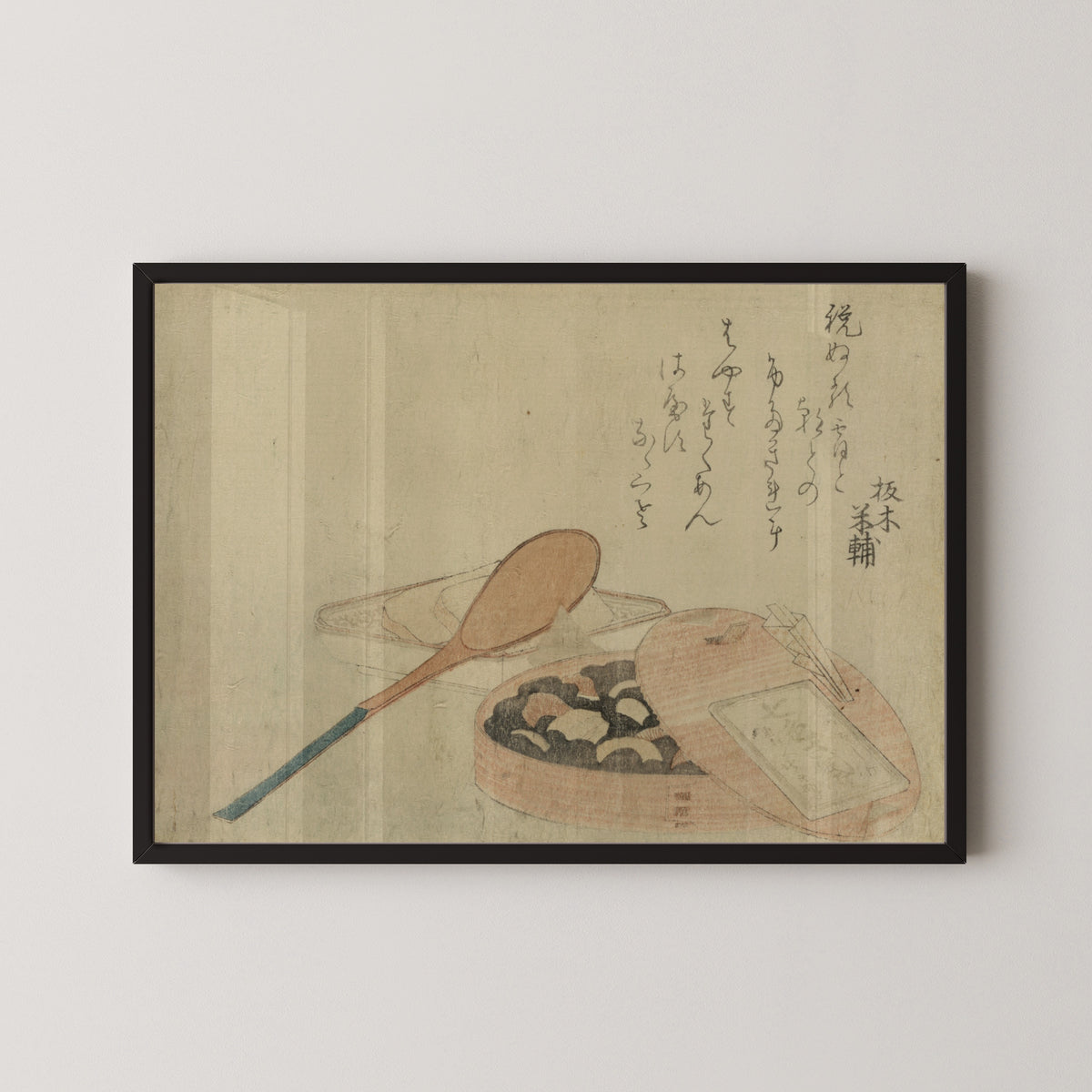 Framed art print of Nanairo Zazenmame by Katsushika Hokusai, in a black frame on a pale wall