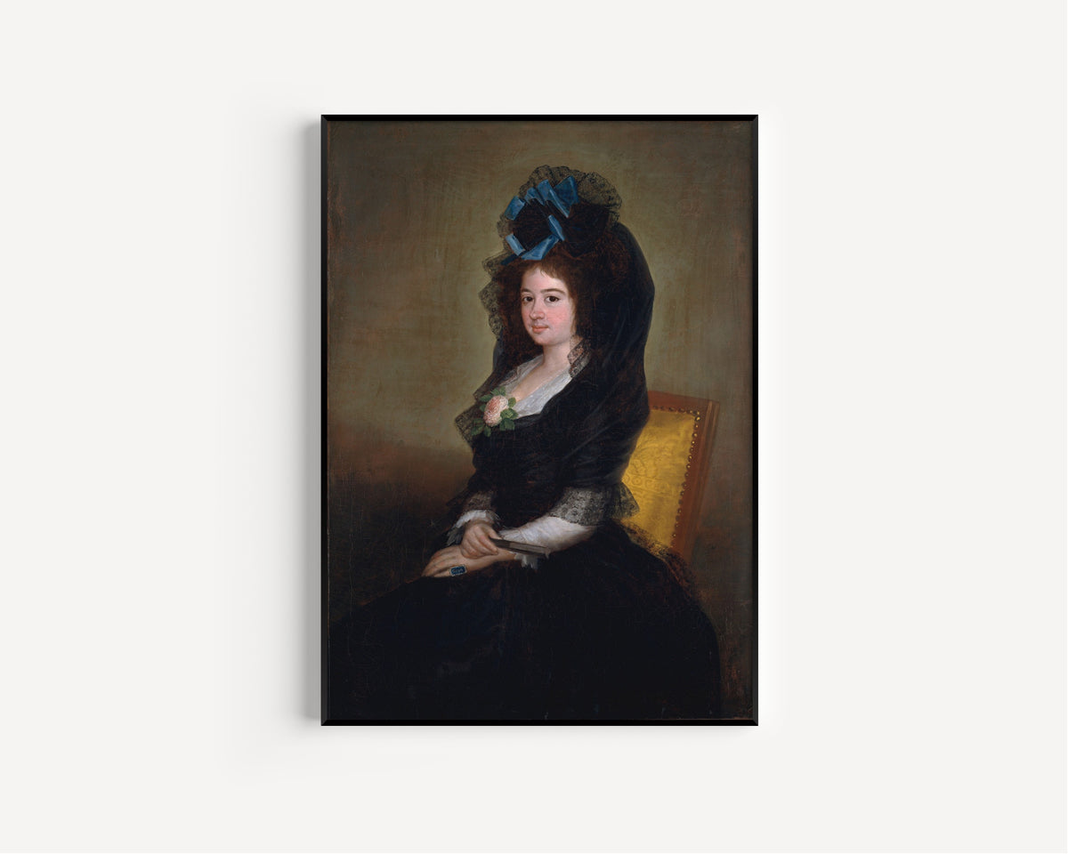 Framed art print of Narcisa Barañano Gayoso de Goicoechea by Francisco de Goya, in a slim black frame on a plain white wall