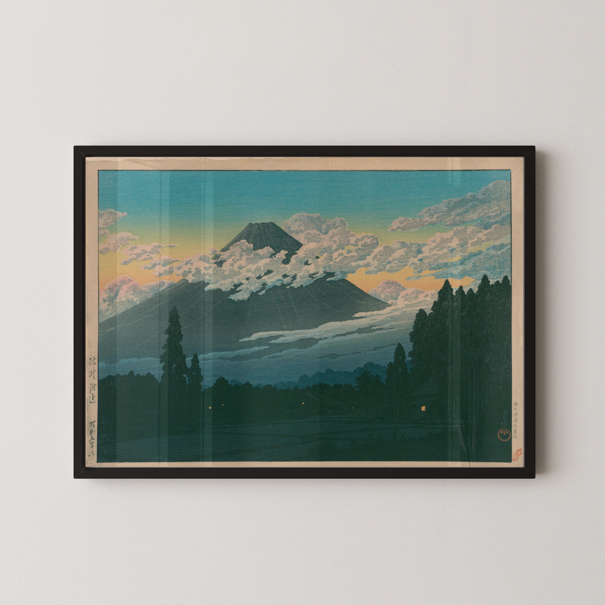 Framed art print of Near Susono by Kawase Hasui, in a black frame on a pale wall