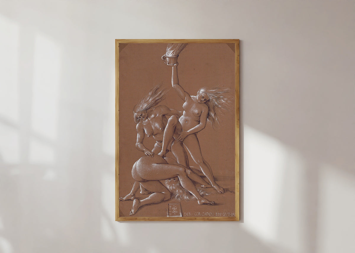 Framed art print of New Year's Greeting with Three Witches by Hans Baldung Grien, in a light wood frame on a sunlit white wall