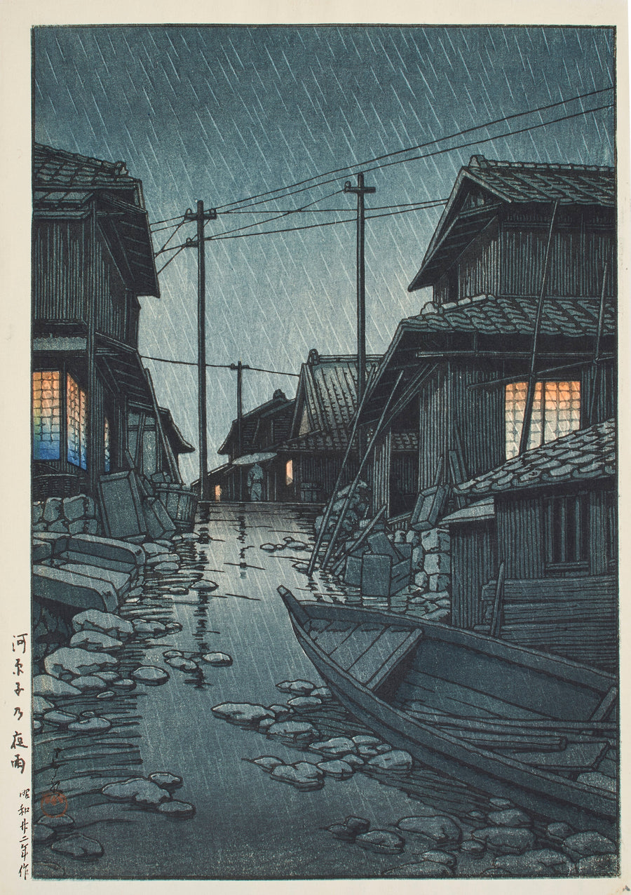 Kawase Hasui — Night Rain at Kawarago | Japanese Woodblock Print (Shin Hanga) shown to scale on a wall above a sofa