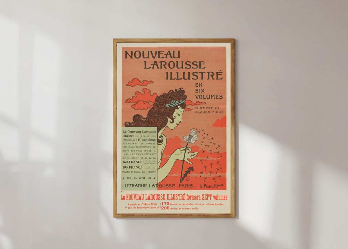 Framed art print of Nouveau Larousse Illustré by Eugène Grasset, in a light wood frame on a sunlit white wall