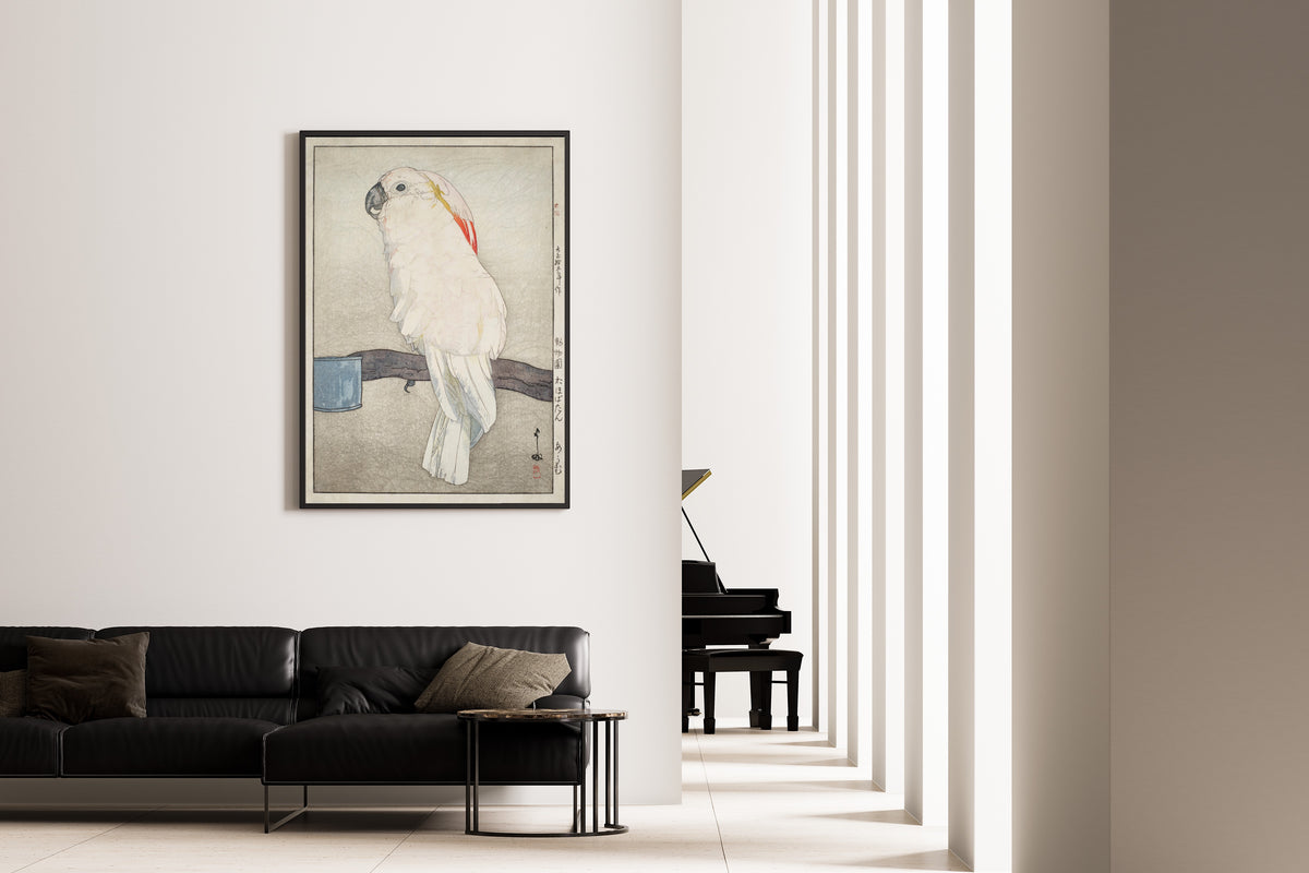 Framed art print of Obatan Parrot by Hiroshi Yoshida, on the wall of a minimal living room