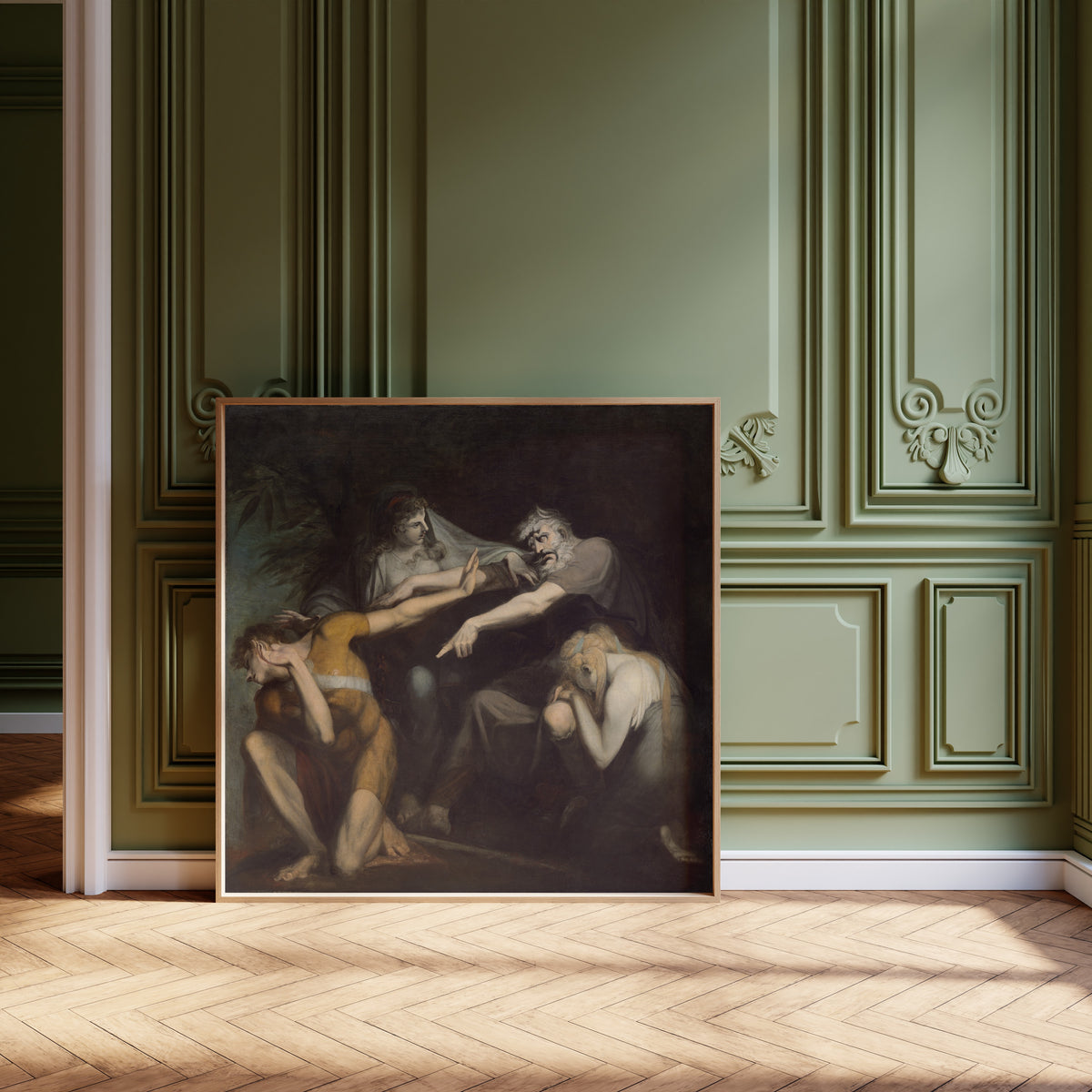 Framed art print of Oedipus Cursing His Son, Polynices by Henry Fuseli, leaning against olive-green panelling on a herringbone floor