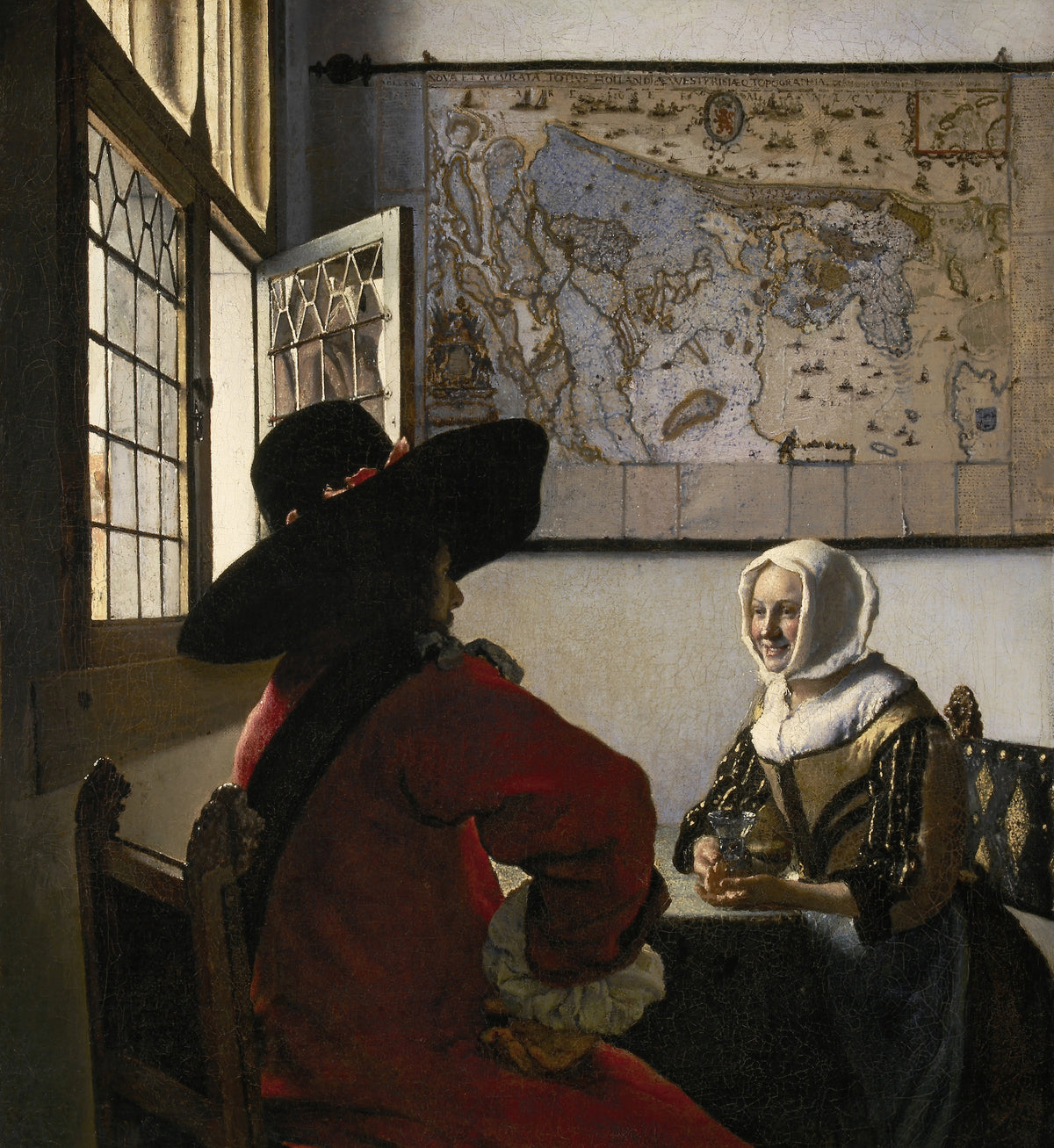 Officer and Laughing Girl by Johannes Vermeer — A smiling woman holds a glass across from an officer in a wide hat