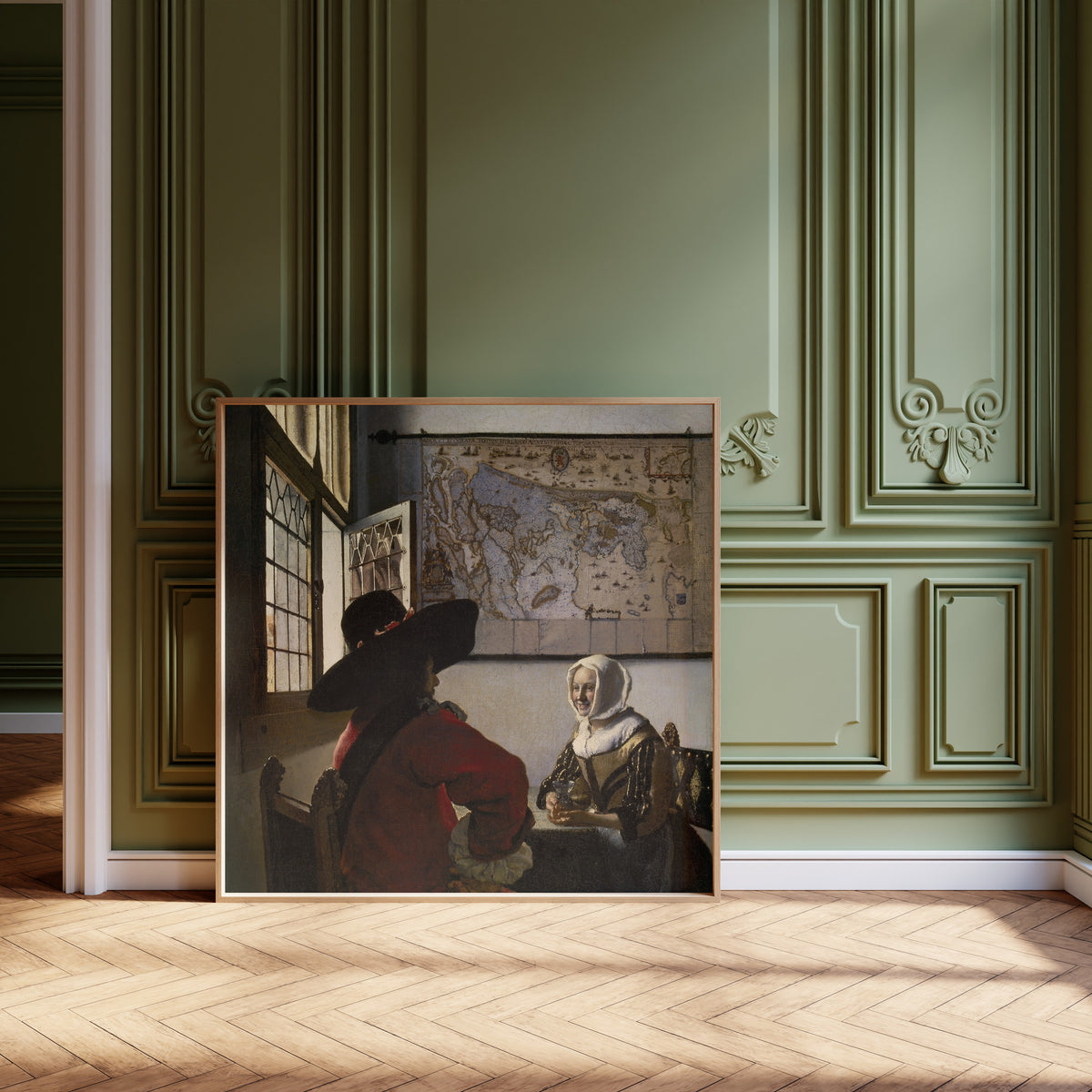 Framed art print of Officer and Laughing Girl by Johannes Vermeer, leaning against olive-green panelling on a herringbone floor