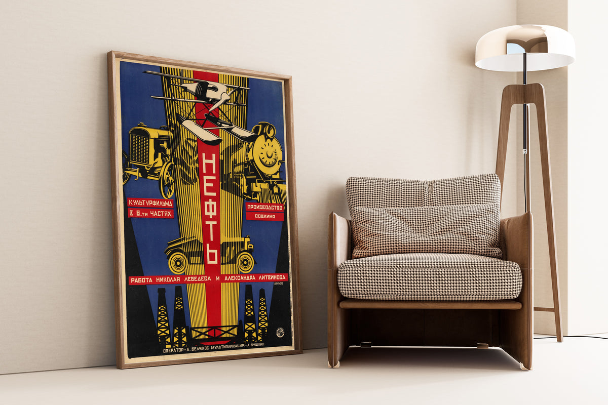 Framed art print of Oil by Alexander Naumov, leaning against a wall beside an armchair and a floor lamp