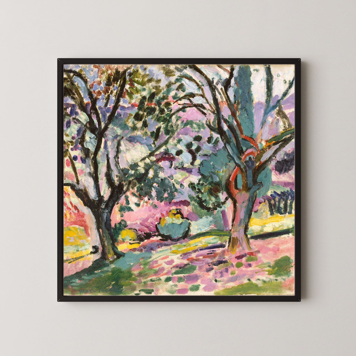 Framed art print of Olive Trees at Collioure by Henri Matisse, in a black frame on a pale wall