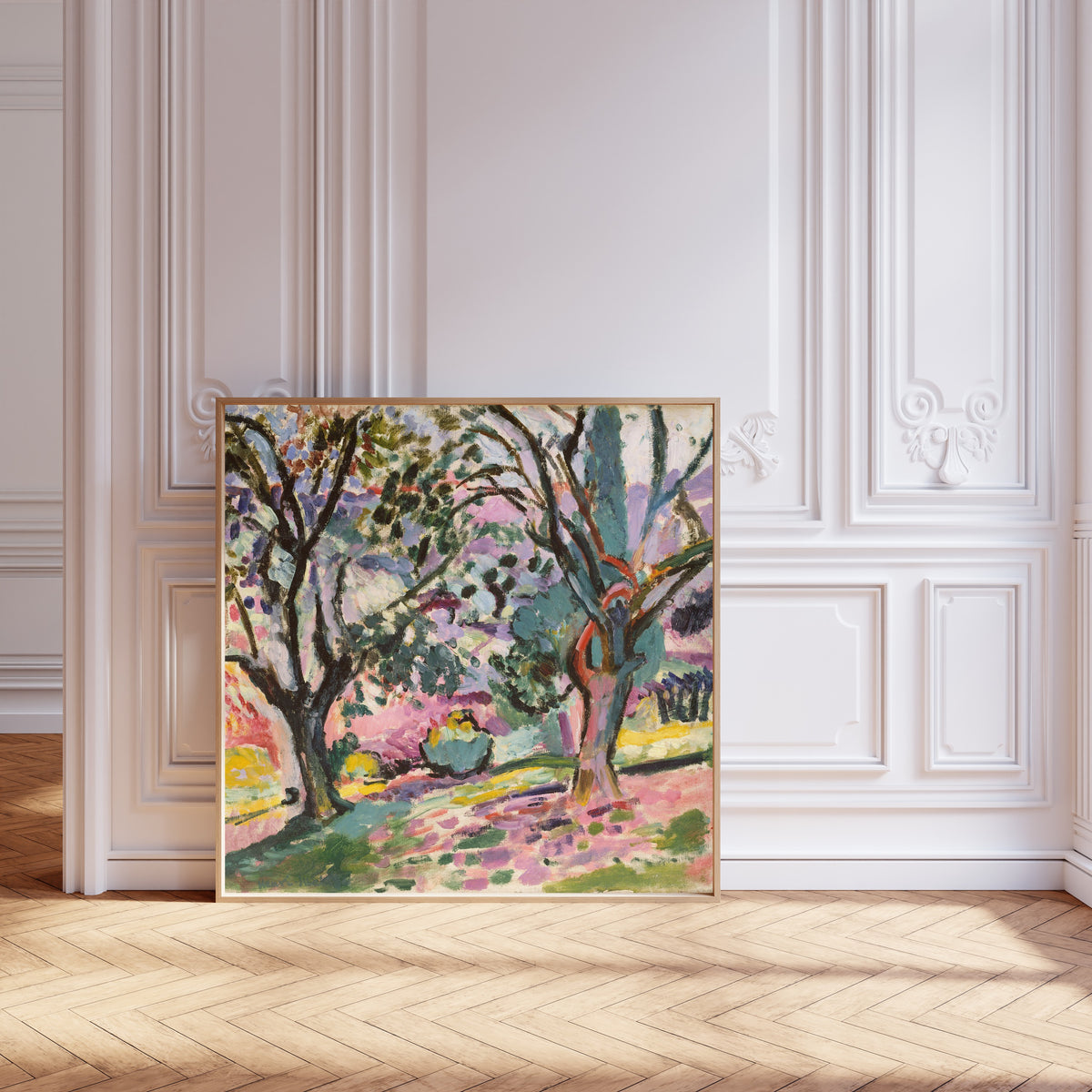Framed art print of Olive Trees at Collioure by Henri Matisse, leaning against pale pink panelling on a herringbone floor