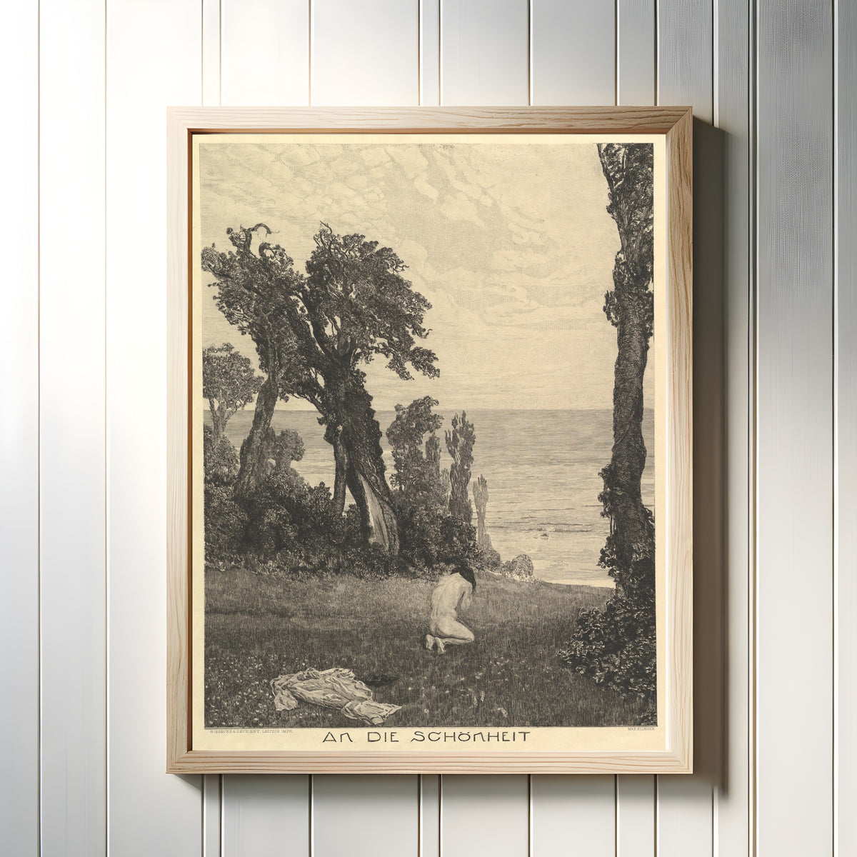 Framed art print of On Death II: To Beauty by Max Klinger, in a light wood frame on a white panelled wall