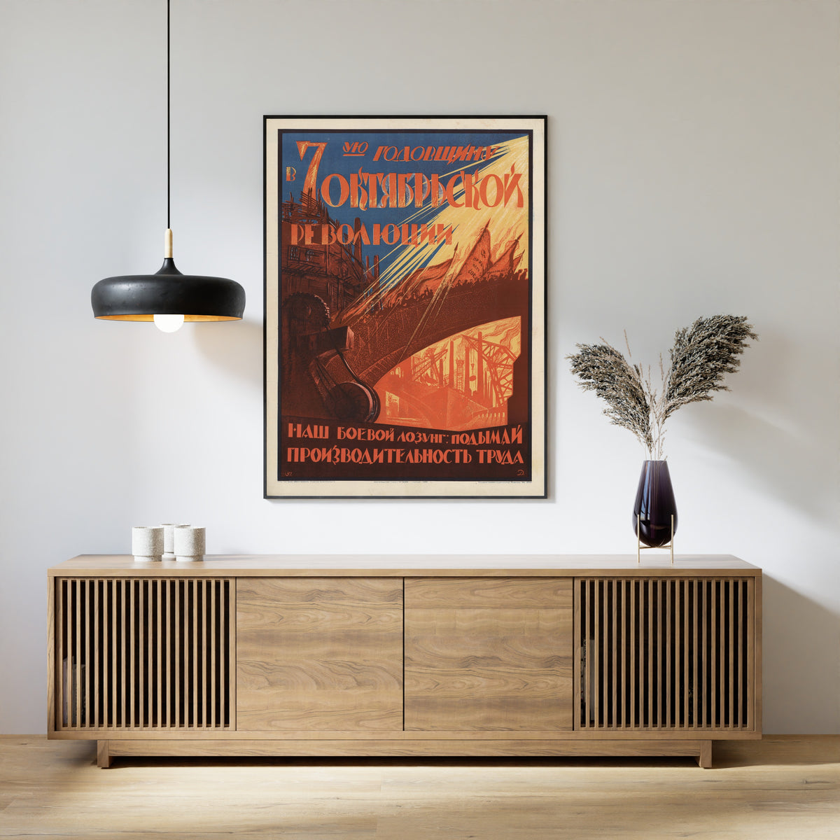 Framed art print of On the Seventh Anniversary of the October Revolution, above a slatted wood sideboard