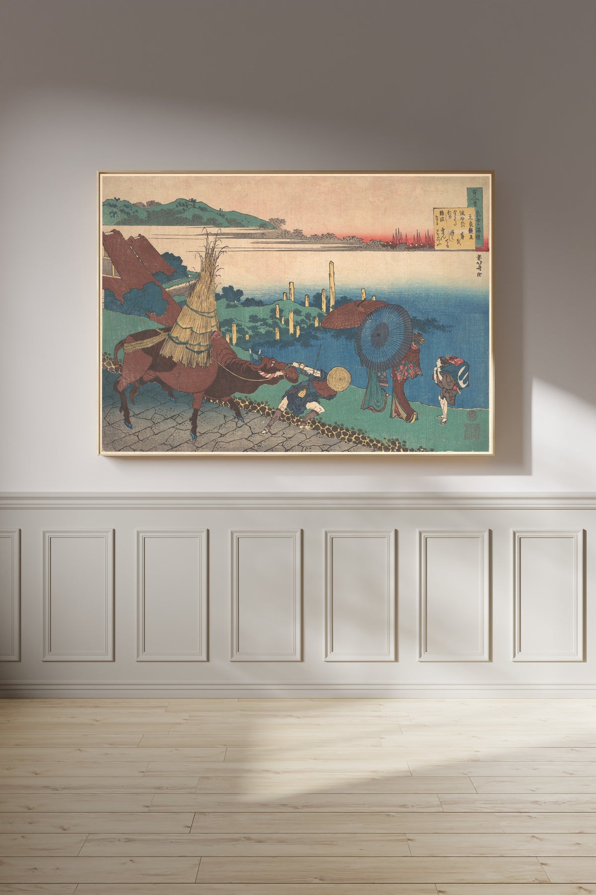 Framed art print of One Hundred Poems Explained by the Nurse: Poem by Motoyoshi Shinnō by Katsushika Hokusai, on a panelled wall in afternoon light
