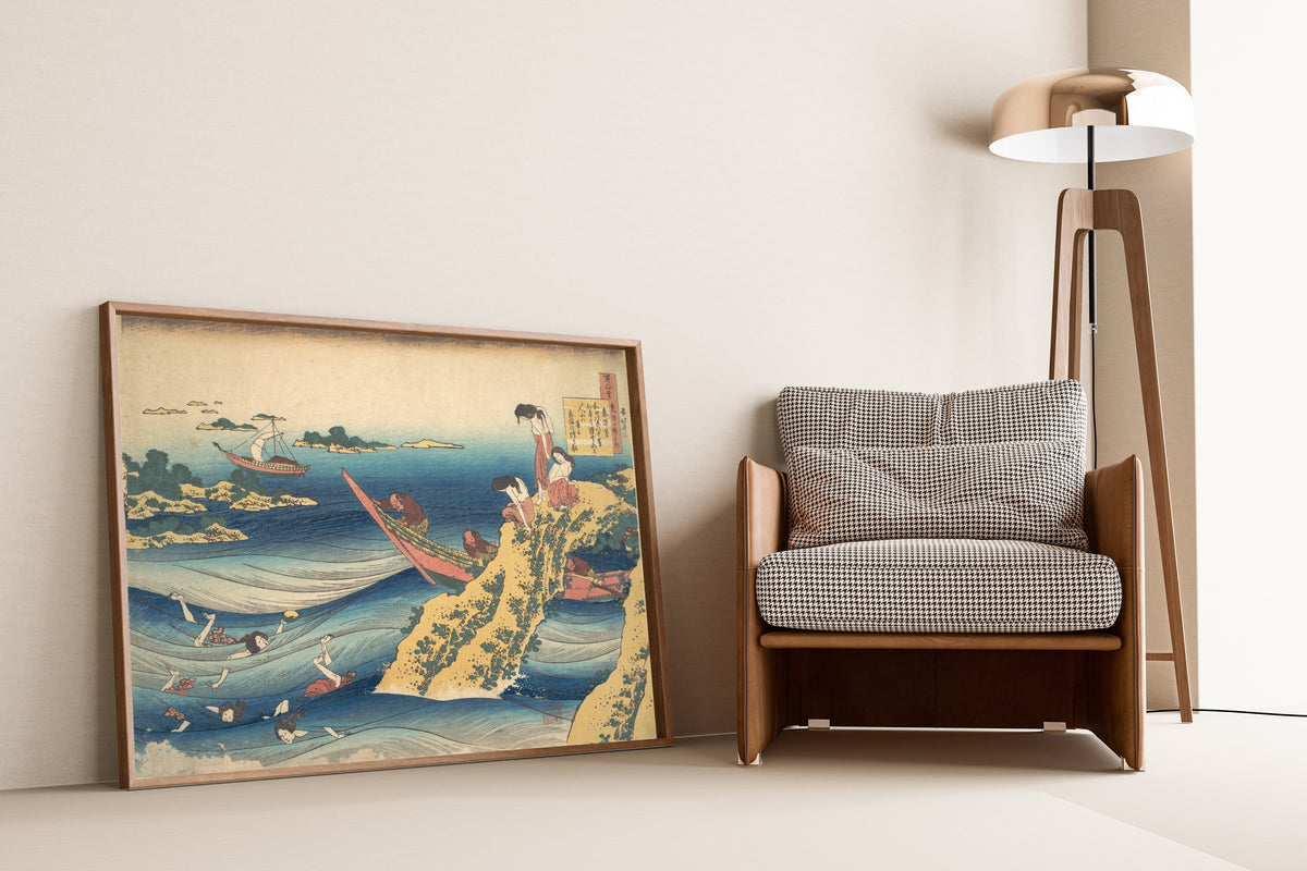 Framed art print of One Hundred Poems Explained by the Nurse: Poem by Sangi… by Katsushika Hokusai, leaning against a wall beside an armchair and a floor lamp
