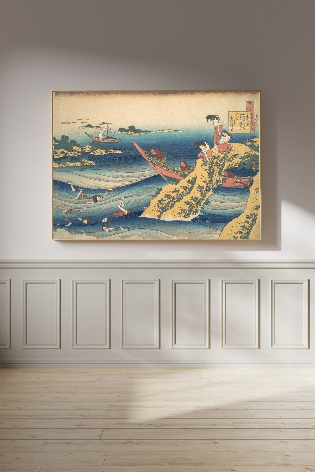 Framed art print of One Hundred Poems Explained by the Nurse: Poem by Sangi no Takamura by Katsushika Hokusai, on a panelled wall in afternoon light
