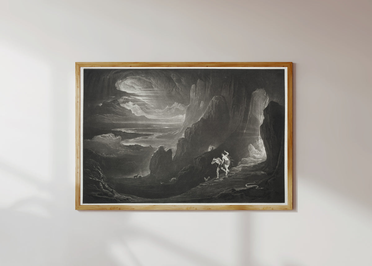 Framed art print of Paradise Lost: Adam and Eve Driven out of Paradise by John Martin, in a light wood frame on a sunlit white wall