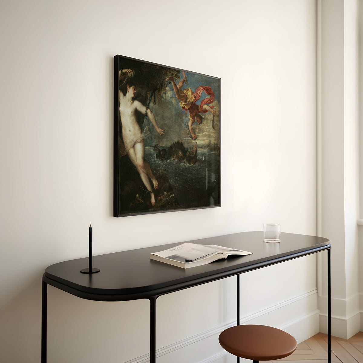 Framed art print of Perseus and Andromeda by Titian, above a slim black console table