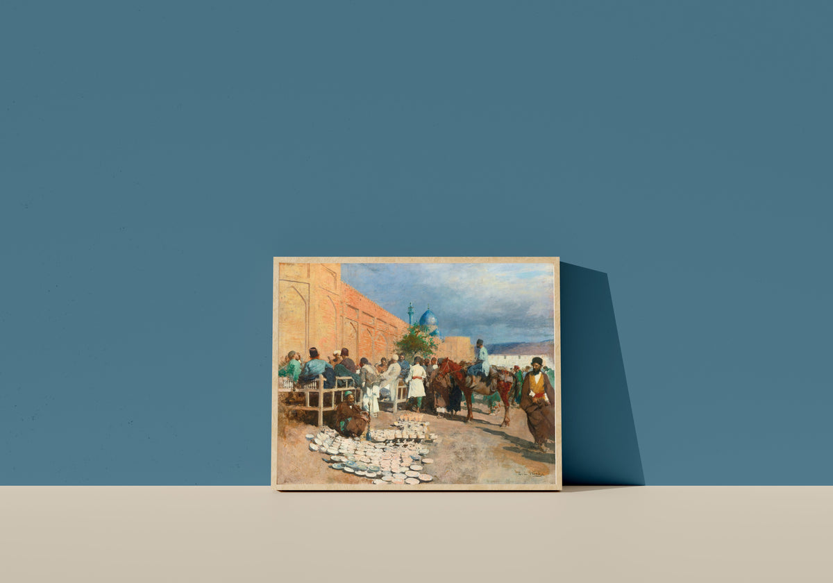 Framed art print of The Pottery Seller by Edwin Lord Weeks, in a light wood frame leaning on a blue wall