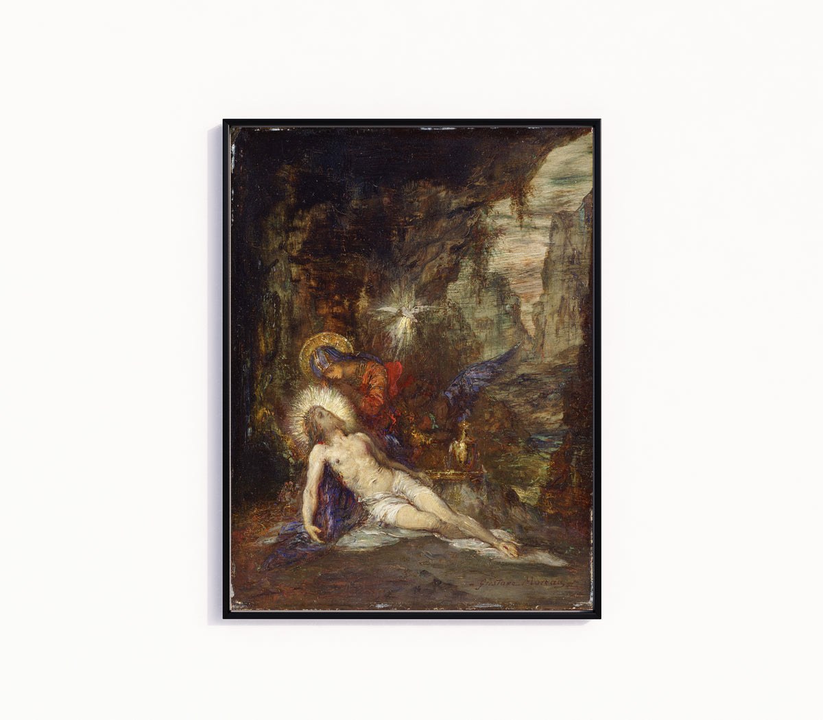 Framed art print of Pietà by Gustave Moreau, in a slim black frame on a plain white wall