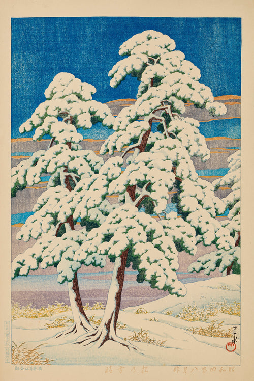 Pines in Clear Weather After Snow by Kawase Hasui — Two snow-laden pines against a deep blue winter sky