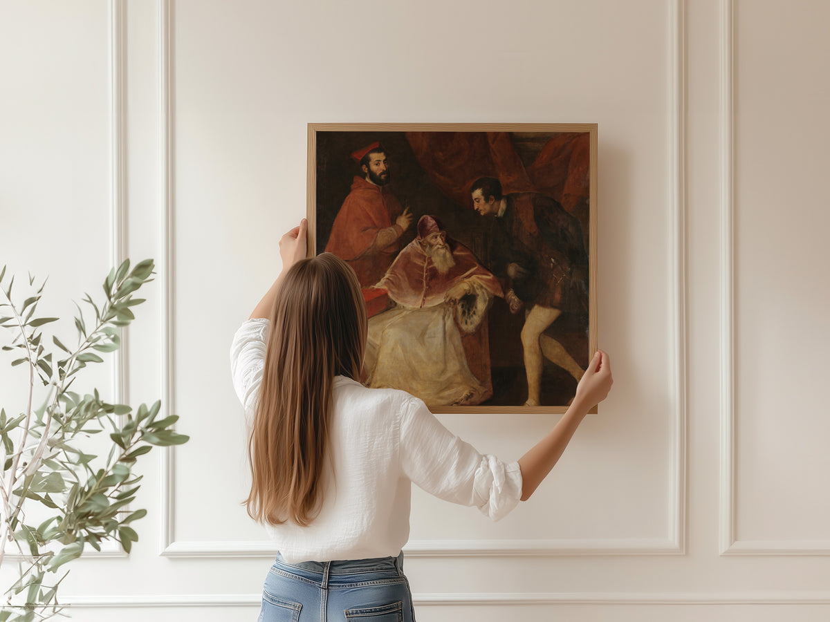 Framed art print of Pope Paul III and His Grandsons by Titian, hung on a panelled wall