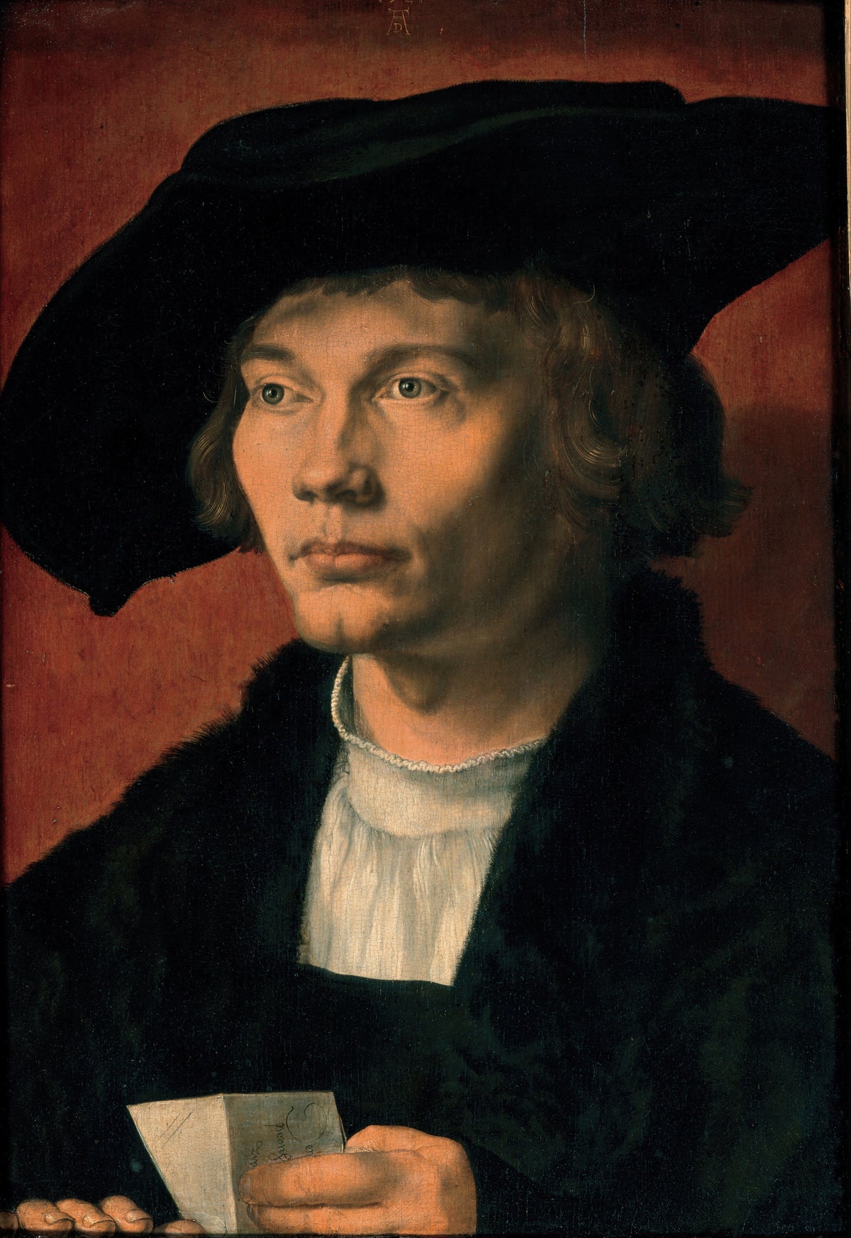 Portrait of Bernhart von Reesen by Albrecht Dürer — A young man in a broad black hat holds a folded letter