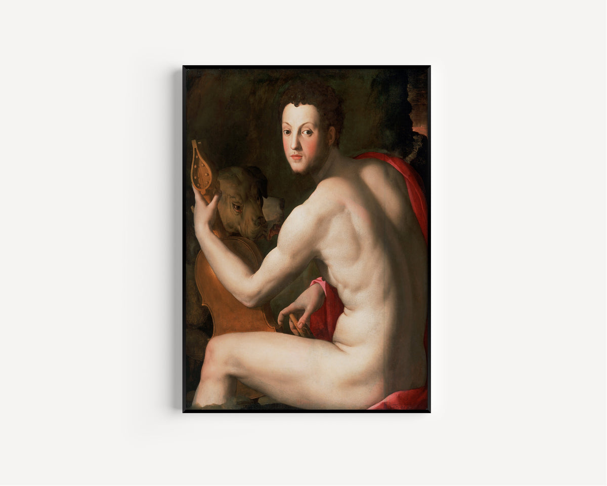Framed art print of Portrait of Cosimo I de’ Medici as Orpheus by Bronzino, in a slim black frame on a plain white wall