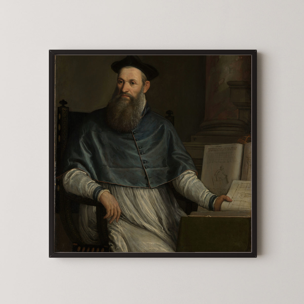 Framed art print of Portrait of Daniele Barbaro by Paolo Veronese, in a black frame on a pale wall