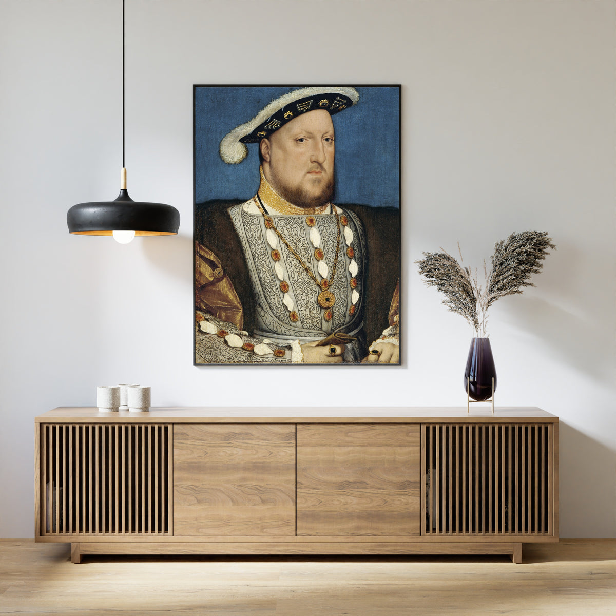 Framed art print of Portrait of Henry VIII by Hans Holbein the Younger, above a slatted wood sideboard