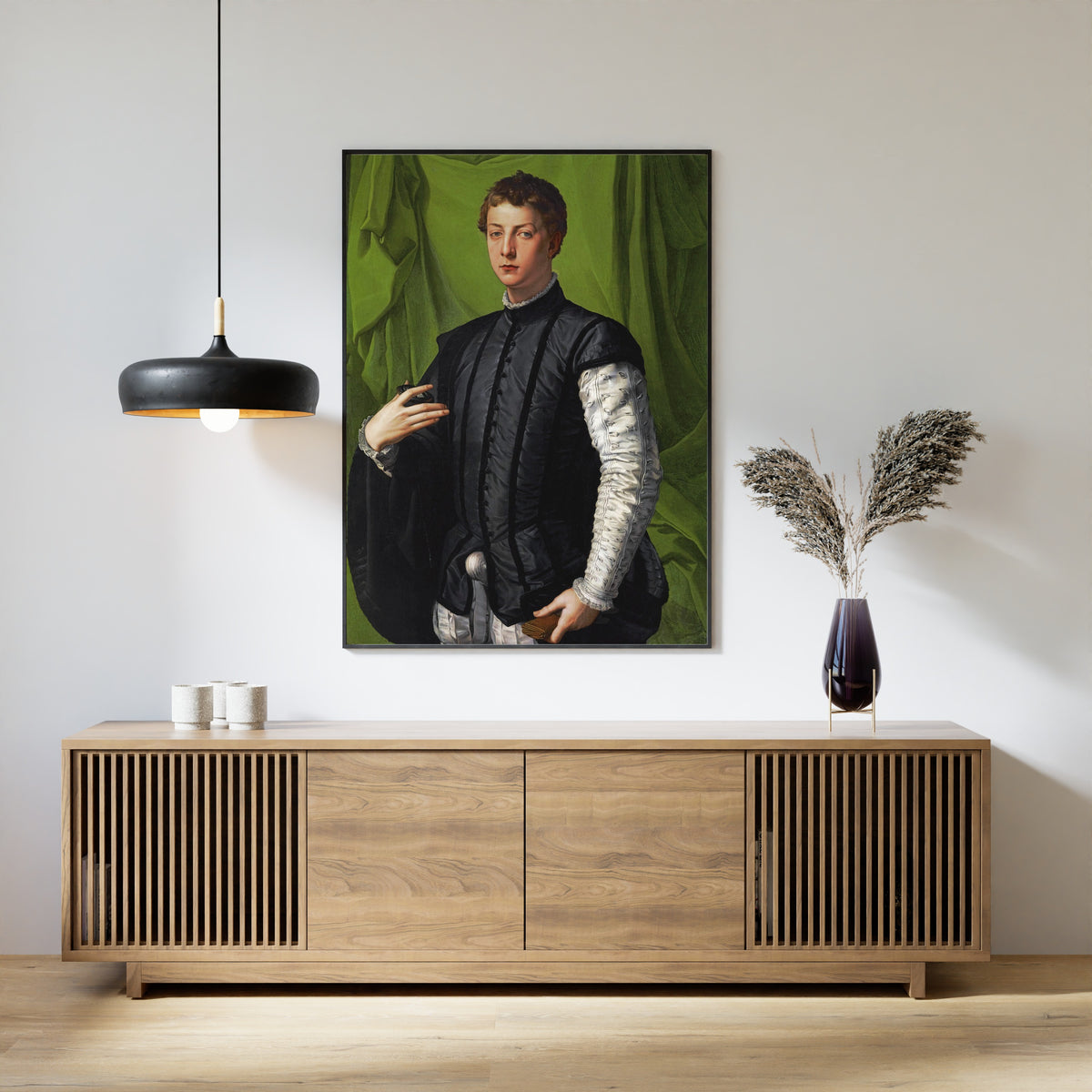Framed art print of Portrait of Lodovico Capponi by Bronzino, above a slatted wood sideboard