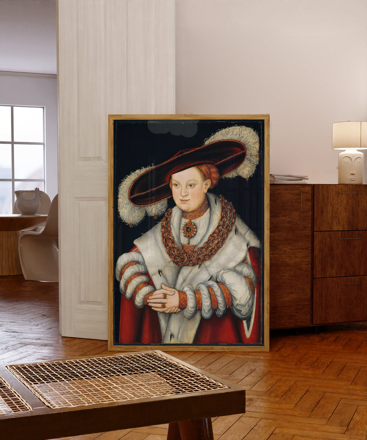Framed art print of Portrait of Magdalena of Saxony, Wife of… by Lucas Cranach the Elder, in a light wood frame leaning in a warm room with a parquet floor
