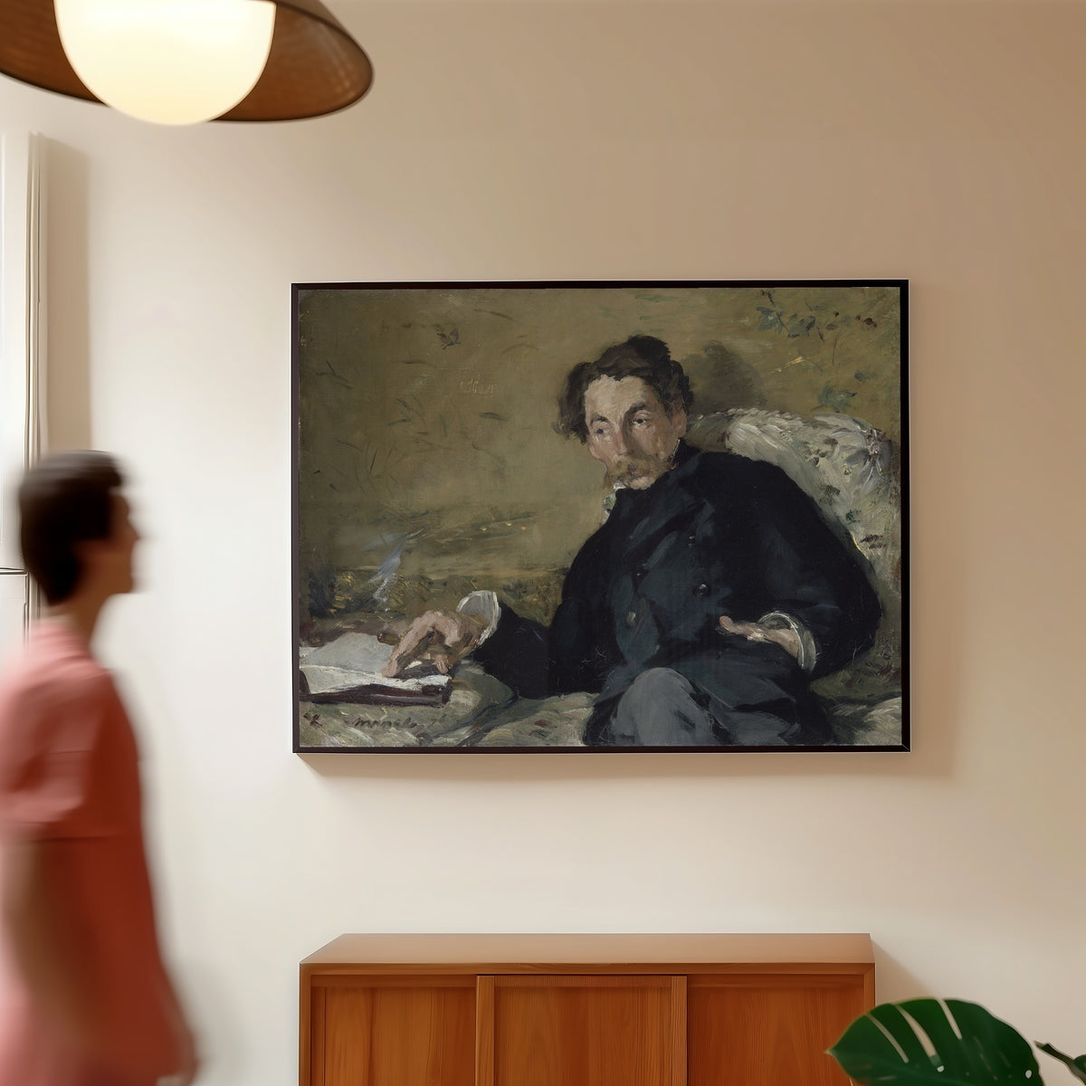 Framed art print of Portrait of Stéphane Mallarmé by Édouard Manet, in a slim black frame on a warm wall in a sunlit room