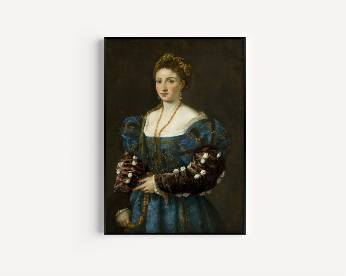 Framed art print of Portrait of a Lady (La Bella) by Titian, in a slim black frame on a plain white wall