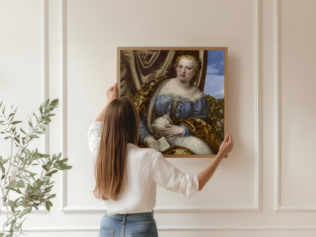 Framed art print of Portrait of a Lady as Saint Agnes by Paolo Veronese, hung on a panelled wall