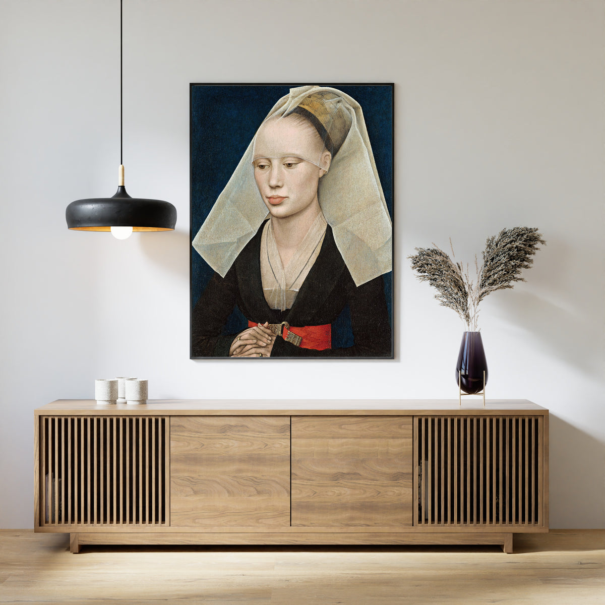 Framed art print of Portrait of a Lady by Rogier van der Weyden, above a slatted wood sideboard