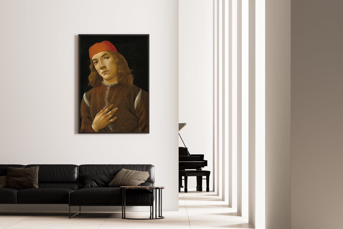Framed art print of Portrait of a Youth by Sandro Botticelli, on the wall of a minimal living room