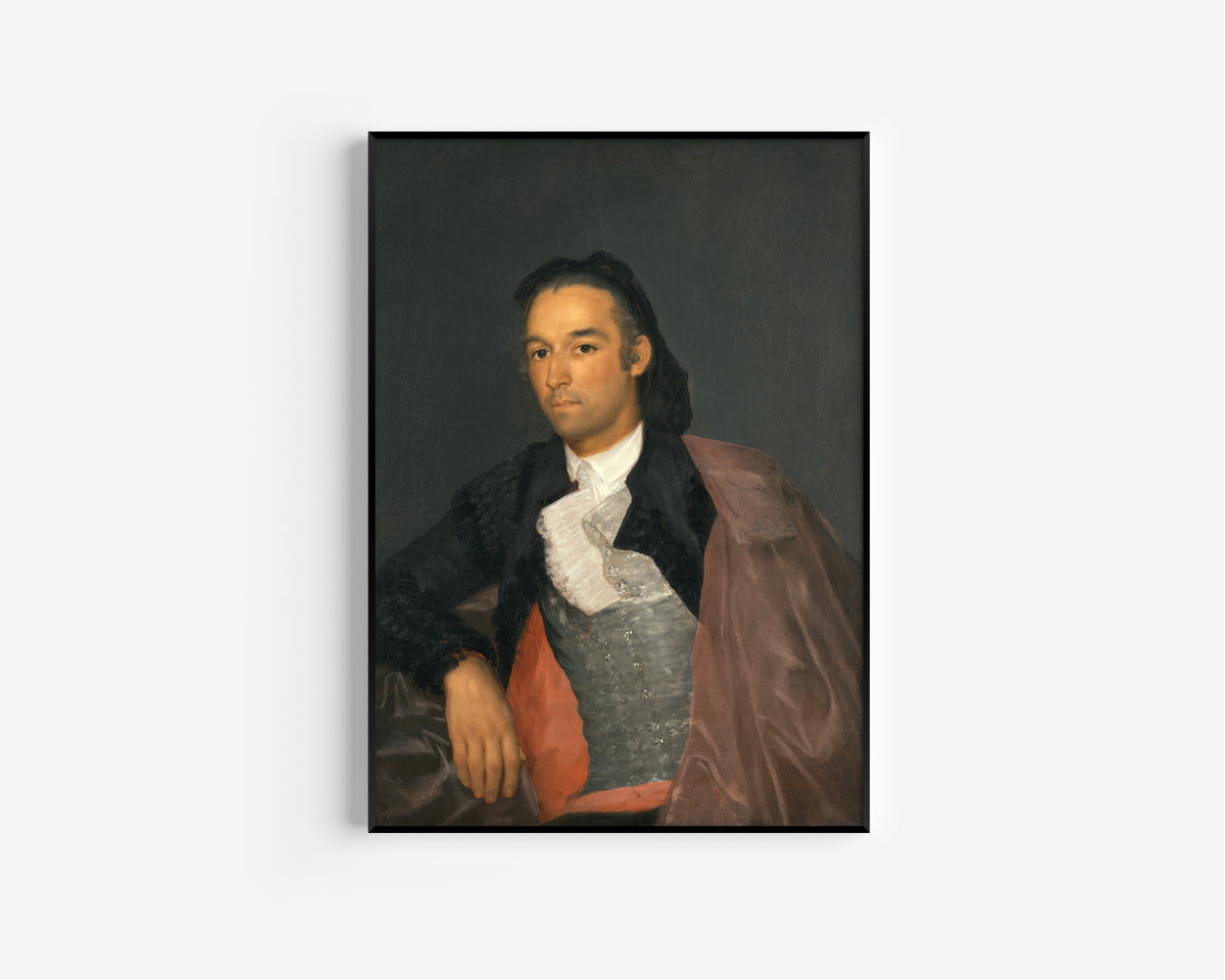 Framed art print of Portrait of the Matador Pedro Romero by Francisco de Goya, in a slim black frame on a plain white wall