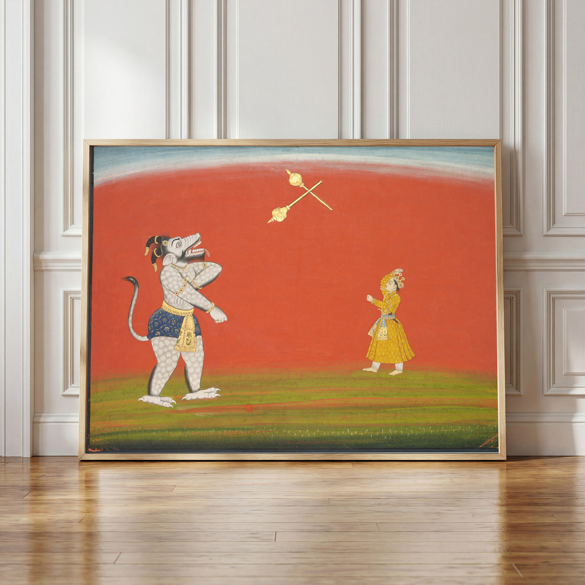 Framed art print of Pradyumna and Samvara Fight with Maces by Pahari school, in a light wood frame leaning against a panelled white wall