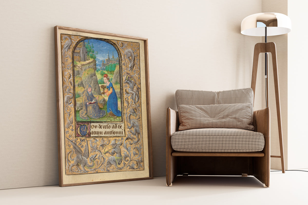 Framed art print of Prayer Book of Charles the Bold: The Temptation of Saint… by Lieven van Lathem, leaning against a wall beside an armchair and a floor lamp