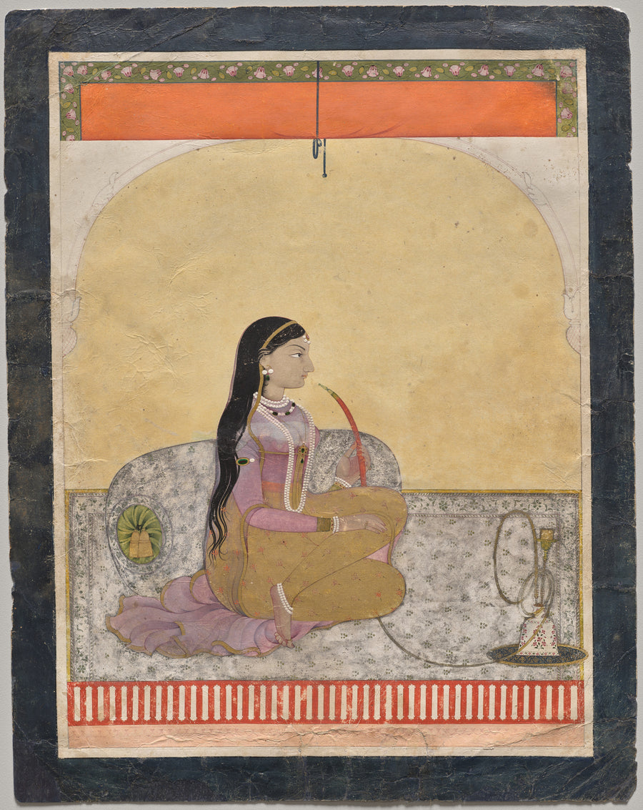 Pahari school — Princess Smoking a Hookah | Indian Miniature Painting Print shown to scale on a wall above a sofa