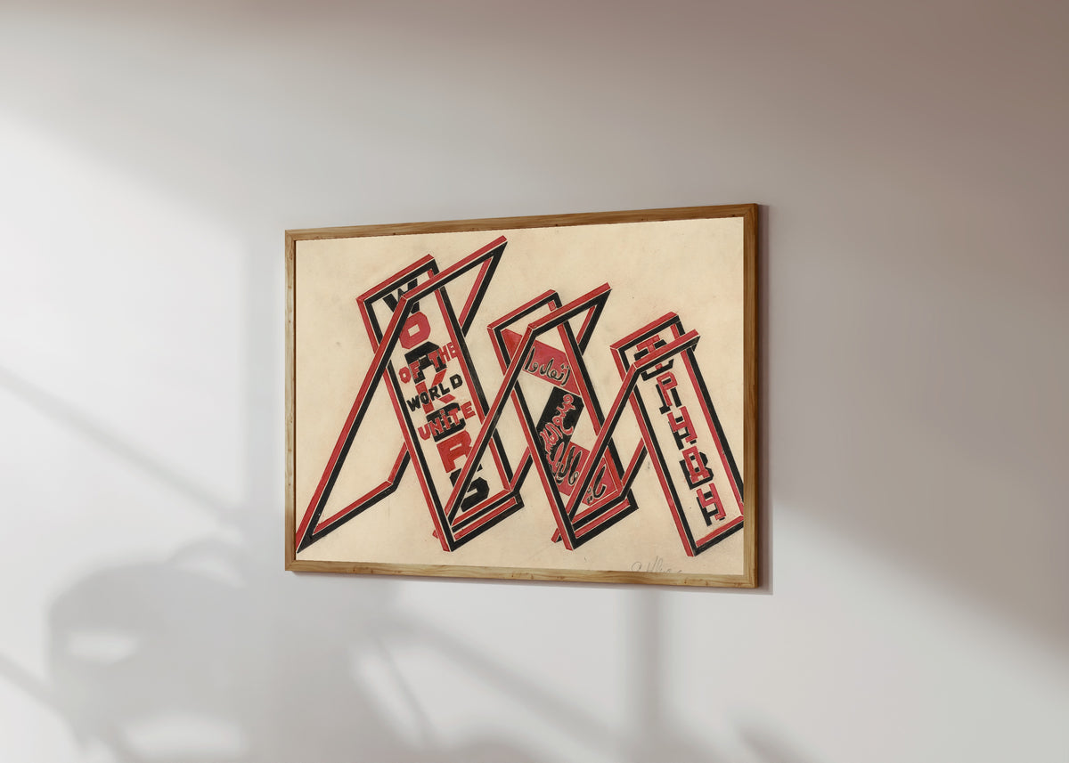 Framed art print of Propaganda stand (Workers of the world unite) by Gustav Klutsis, in a light wood frame on a sunlit white wall, seen at a slight angle