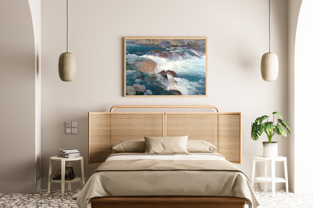 Framed art print of Rapid Stream by Hiroshi Yoshida, above a cane-headboard bed