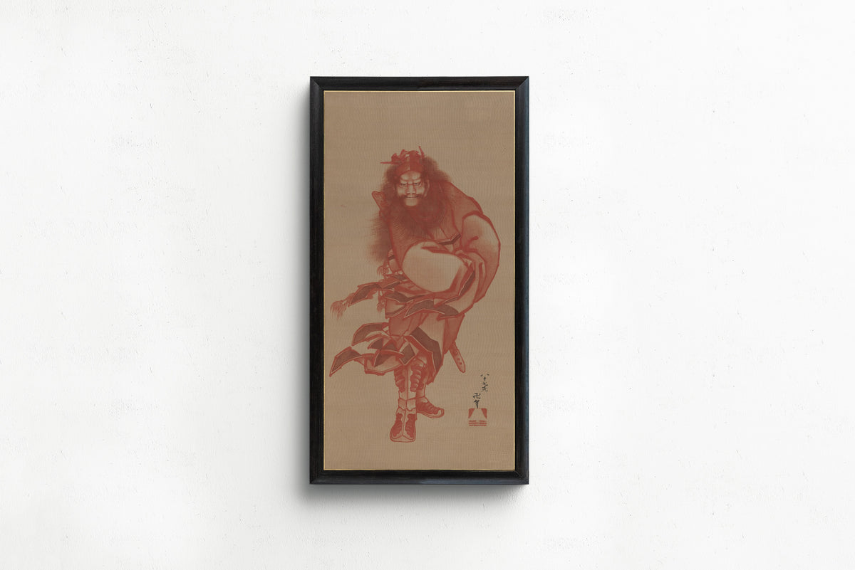 Framed art print of Red Zhong Kui, the Demon Queller by Katsushika Hokusai, in a slim black frame on a plain white wall