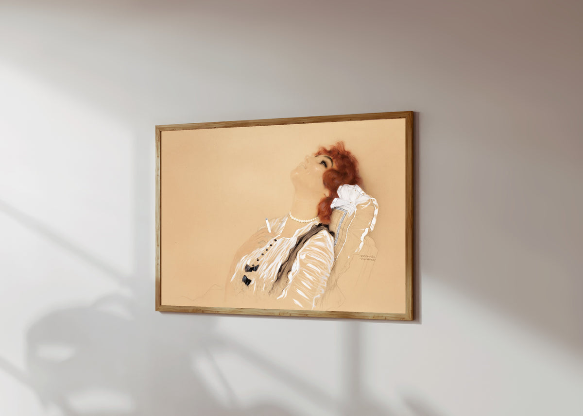 Framed art print of Redhead with a Cigarette by Raphael Kirchner, in a light wood frame on a sunlit white wall, seen at a slight angle