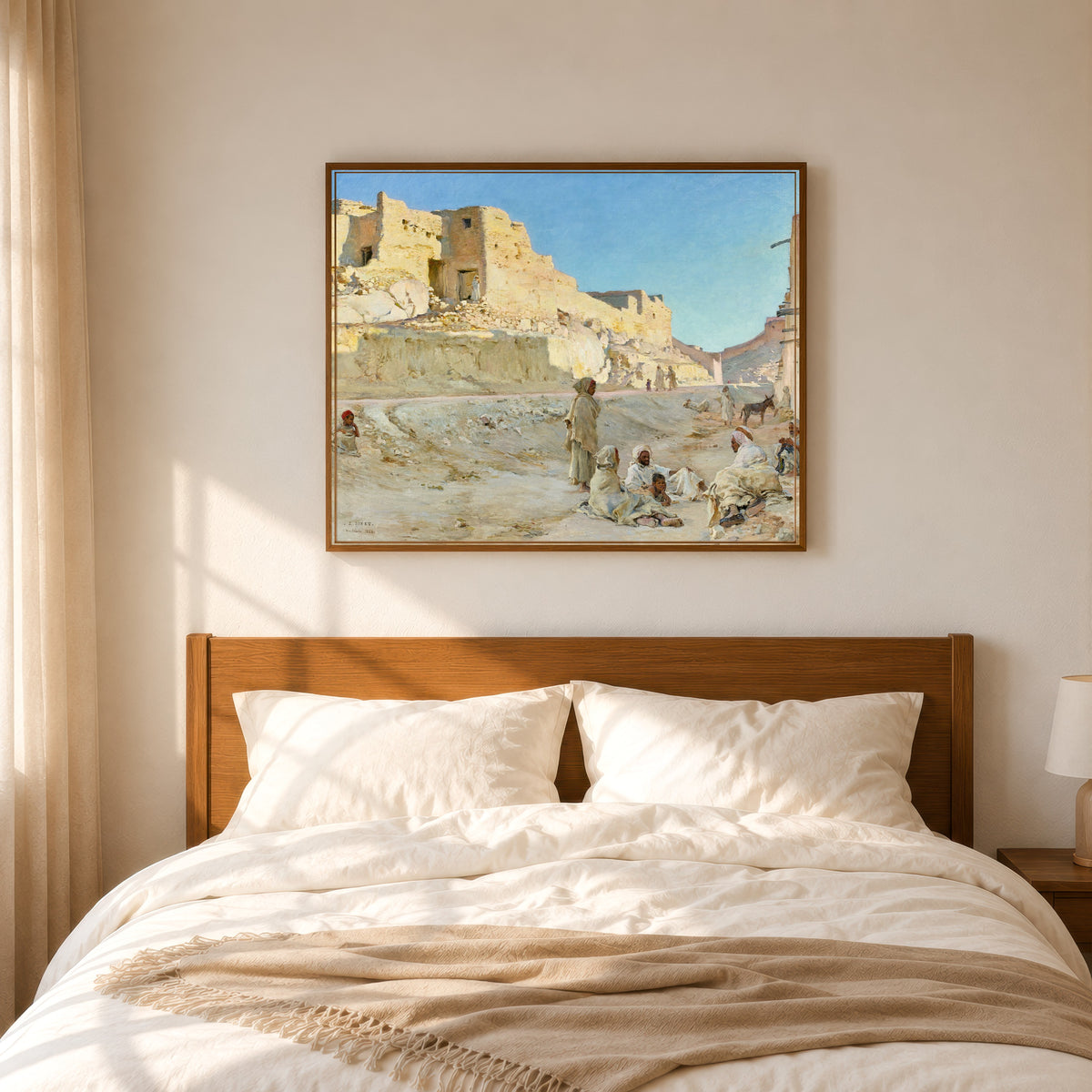 Framed art print of Repos à l'ombre, Bou Saâda by Étienne Dinet, in a slim wood frame above a bed in a sunlit bedroom