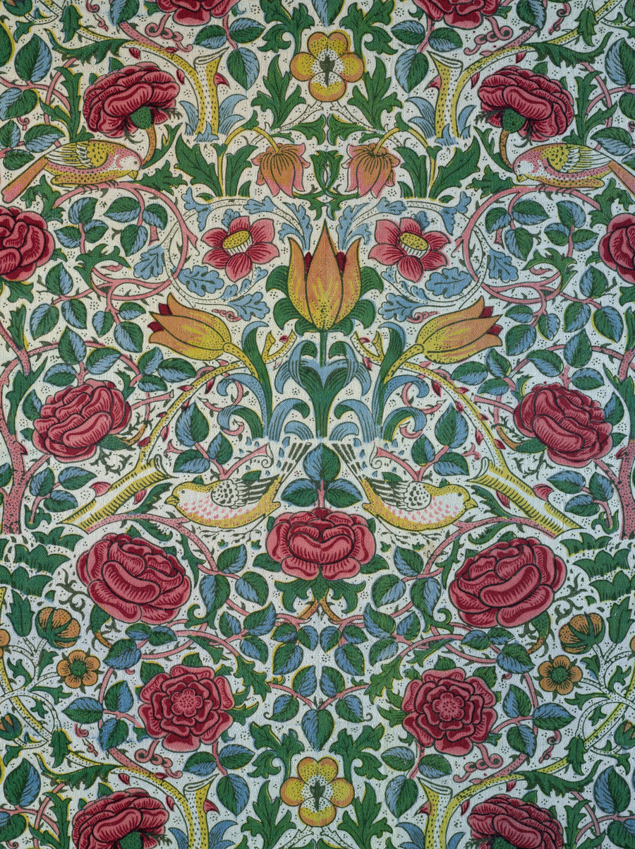 William Morris — Rose | Botanical Art Print shown to scale on a wall above a sofa