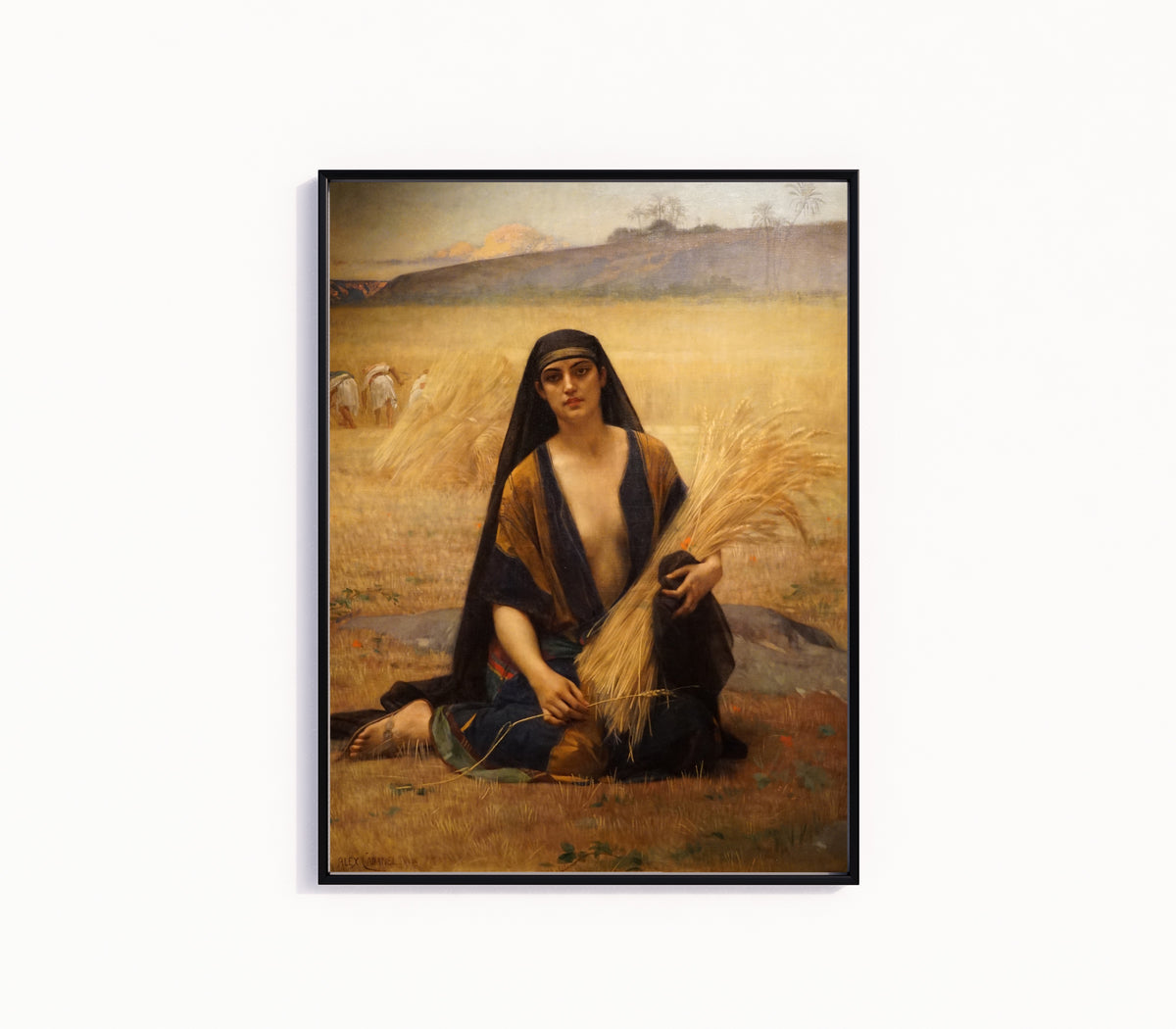 Framed art print of Ruth Gleaning in the Fields of Boaz by Alexandre Cabanel, in a slim black frame on a plain white wall