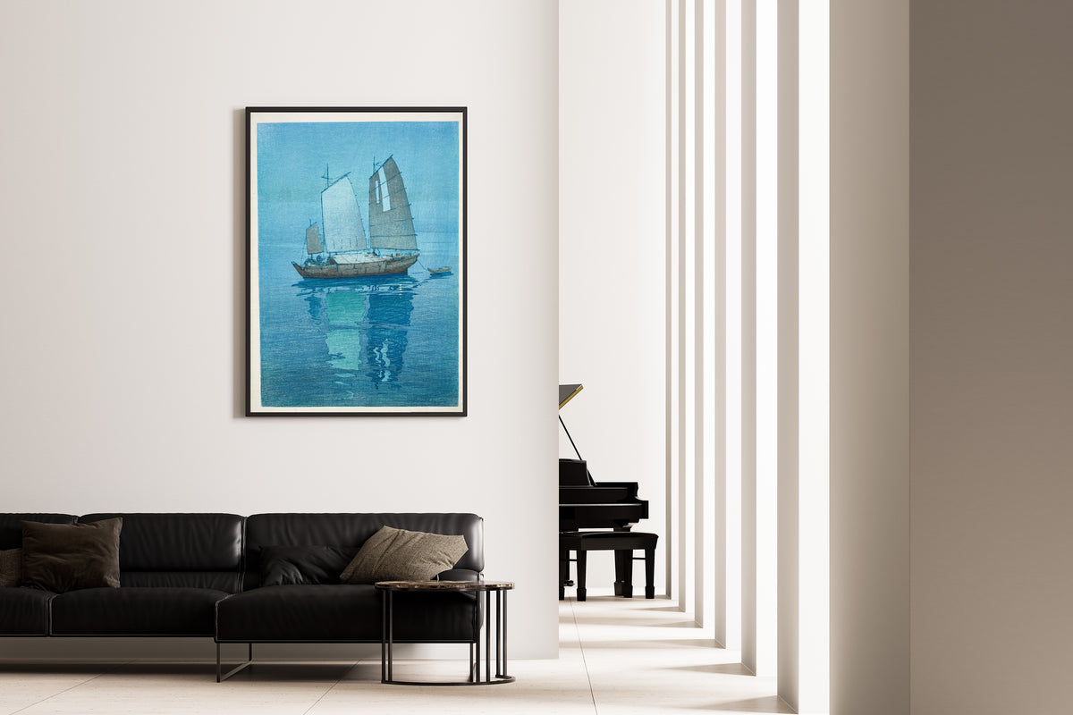 Framed art print of Sailing Boats by Hiroshi Yoshida, on the wall of a minimal living room