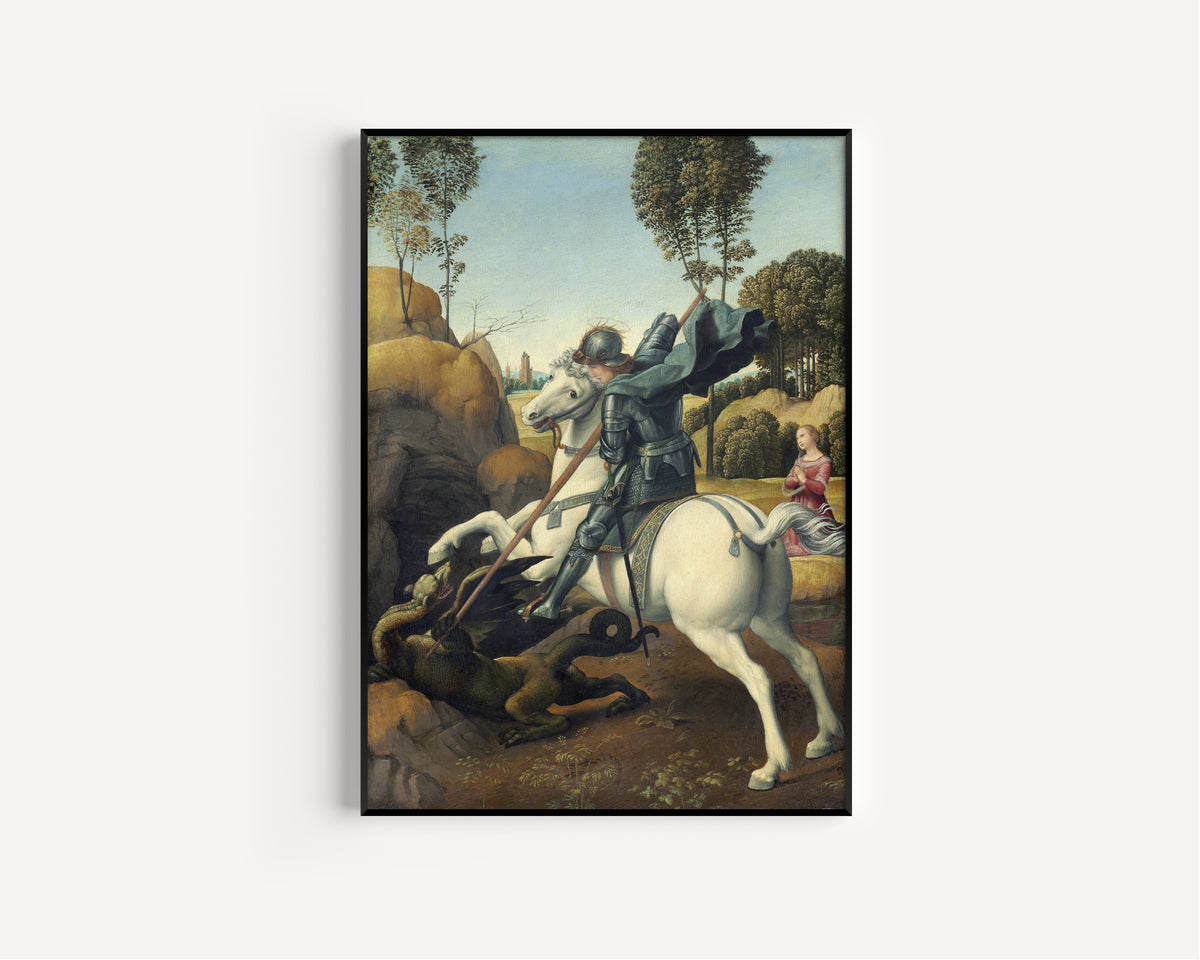 Framed art print of Saint George and the Dragon by Raphael, in a slim black frame on a plain white wall